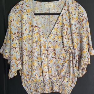 Adorable Top With A Fitted Waist